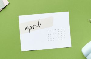 April calendar on green background.