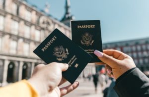 Naturalized U.S. Citizen two people holding American passports
