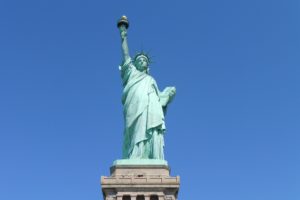 Statute of Liberty against a blue sky.