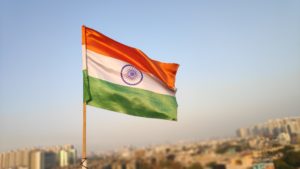 Indian flag over a city.