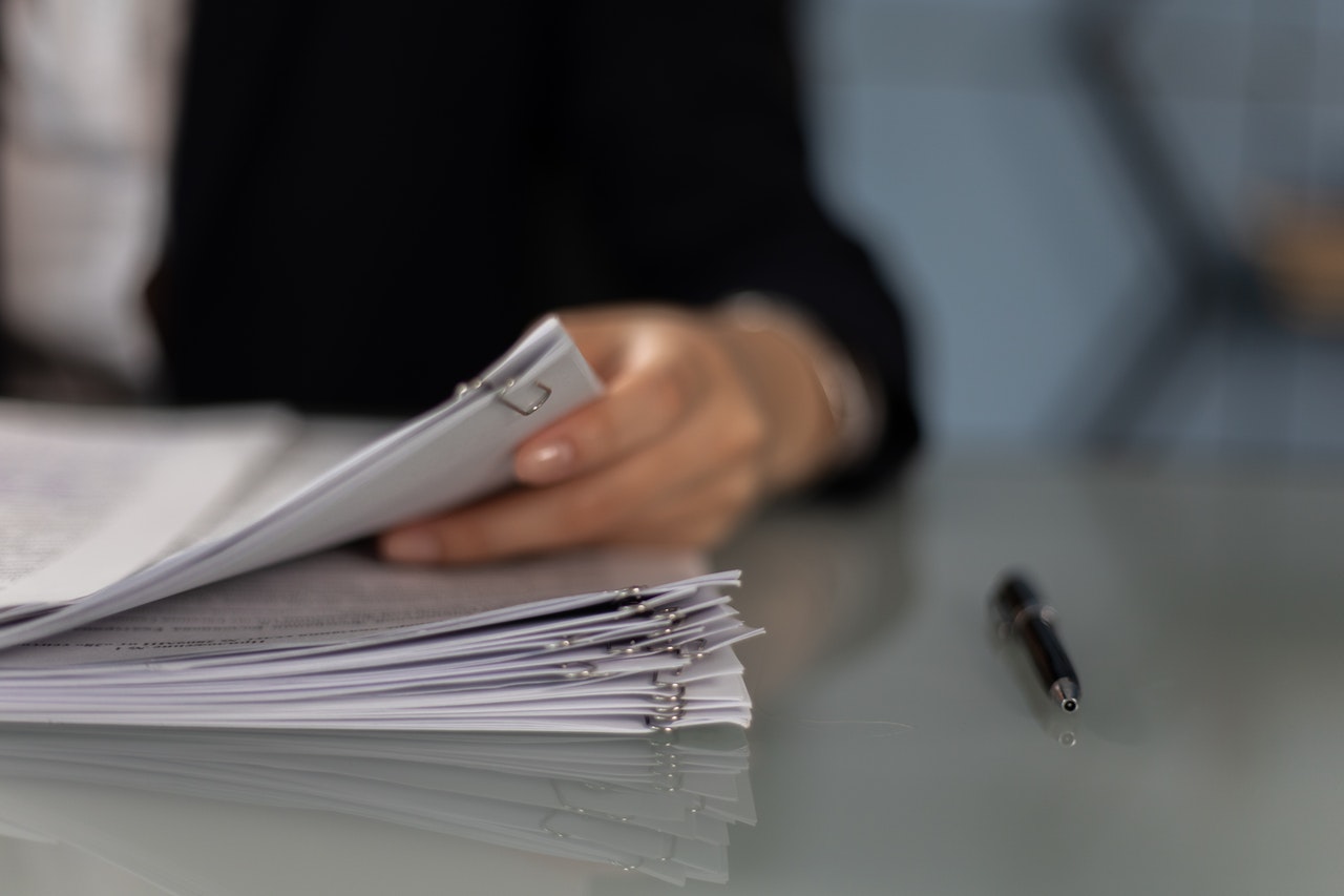 Image of person filing documents, example of Citizenship Naturalization filing process at Shihab Burke, LLC, Attorneys At Law.