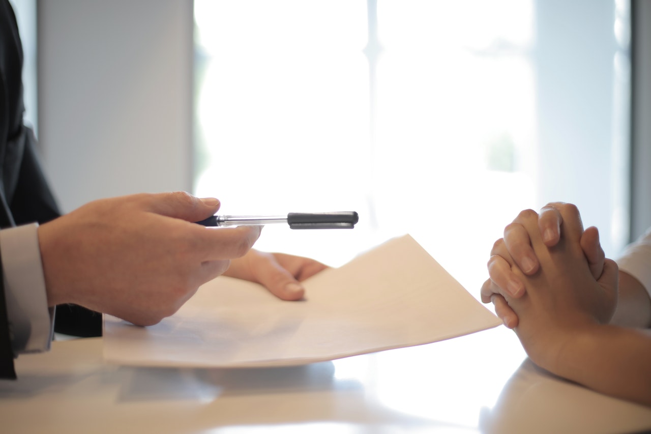 Investor immigration law firm; Image of people working with documents