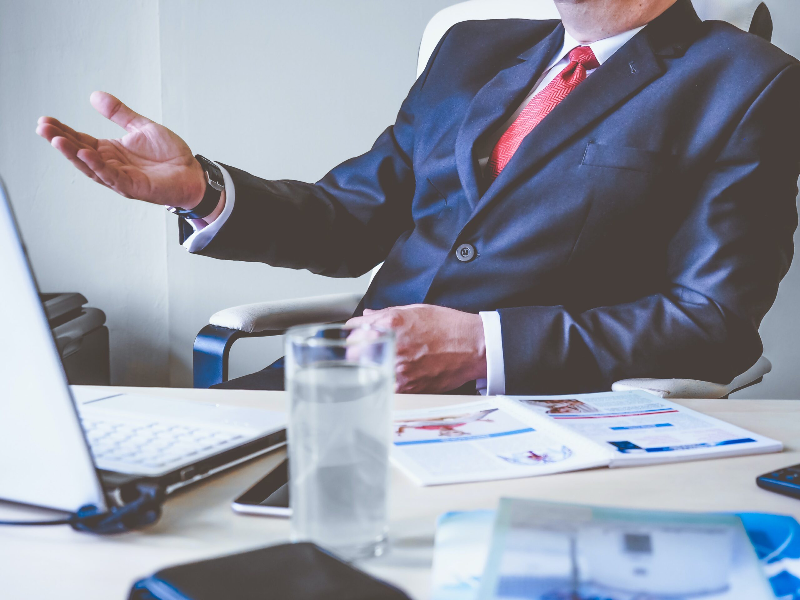 National interest waivers services are offered by the law firms of Shihab Burke, LLC, Attorneys At Law. Image of man working with documents.