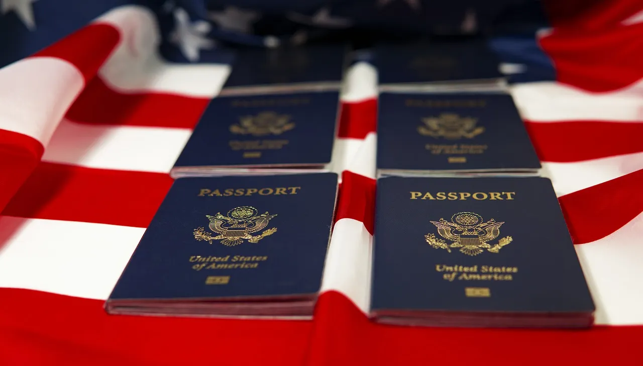 Image of multiple American Passports laying on an American Flag atop a table. The passports are lined up in two columns and rows of two. Image is supposed to signify the freedom and liberty you get when hiring a TN Visa Immigration Lawyer.